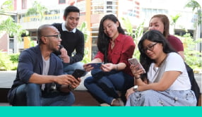 Group of employees talking outside